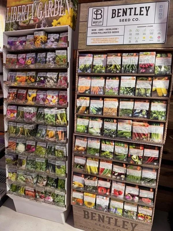 Racks of seed packets inside the retail garden center